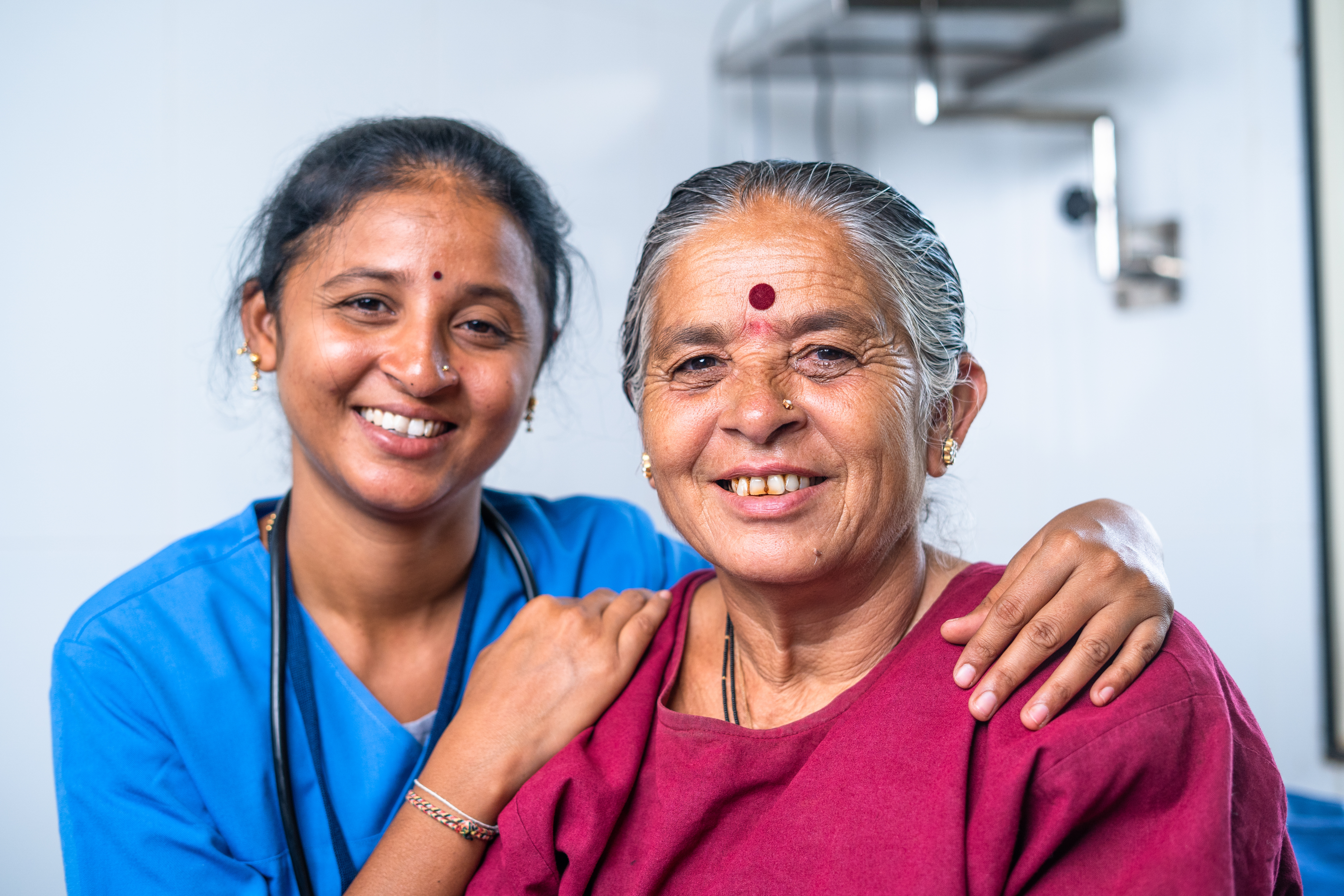 Smiling Indian elderly person receiving care